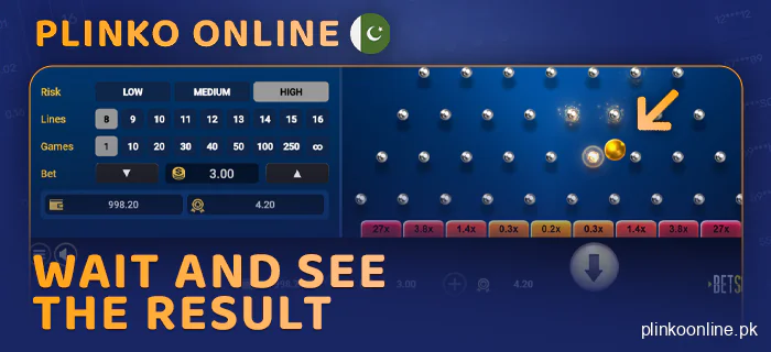 Wait for the result of the Plinko round and collect winnings